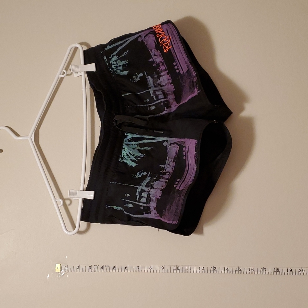 Medium board shorts. Super fun with drawstring tie